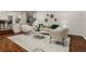 Spacious living room featuring hardwood floors, neutral furniture, and stylish decor at 9368 S Silent Hills Dr, Lone Tree, CO 80124