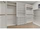 Walk-in closet featuring built-in shelves and drawers for optimal storage at 9368 S Silent Hills Dr, Lone Tree, CO 80124