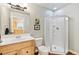 This bathroom features a shower and wood cabinets at 448 Winterthur Cir, Highlands Ranch, CO 80129