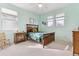 This bedroom features plenty of natural light, a cozy bed, and ample closet space at 448 Winterthur Cir, Highlands Ranch, CO 80129