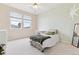 This bedroom features a soft carpet, large windows, and ample floor space at 448 Winterthur Cir, Highlands Ranch, CO 80129