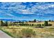 Enjoy breathtaking views of the mountains and community from the neighborhood walking trail at 448 Winterthur Cir, Highlands Ranch, CO 80129