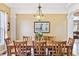 Elegant dining room with hardwood floors, decorative lighting, and stylish decor at 448 Winterthur Cir, Highlands Ranch, CO 80129