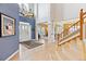 Grand foyer with high ceilings, hardwood floors, a staircase, and elegant decor at 448 Winterthur Cir, Highlands Ranch, CO 80129