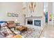 Cozy living room featuring a fireplace, comfortable seating, and stylish decor at 448 Winterthur Cir, Highlands Ranch, CO 80129