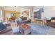 Spacious living room seamlessly connected to dining area, featuring hardwood floors and neutral colors at 448 Winterthur Cir, Highlands Ranch, CO 80129