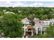 Serene aerial view of upscale neighborhood showcases modern architecture nestled among mature trees, blending urban living with natural beauty at 340 Milwaukee St, Denver, CO 80206