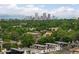 Stunning aerial view of Denver skyline and mountains offering panoramic city views, nestled among lush greenery and modern residences at 340 Milwaukee St, Denver, CO 80206