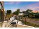 Relaxing balcony seating area with neighborhood views at sunset at 340 Milwaukee St, Denver, CO 80206