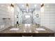 Modern bathroom with double sink vanity and walk-in shower at 340 Milwaukee St, Denver, CO 80206