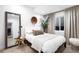 Cozy bedroom featuring neutral tones, stylish decor, and a large mirror reflecting the interior space, creating an inviting atmosphere at 340 Milwaukee St, Denver, CO 80206