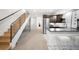 Hallway and Kitchen featuring modern stainless-steel appliances, beautiful cabinets, and an adjacent staircase at 340 Milwaukee St, Denver, CO 80206