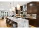 Stylish kitchen with marble island, stainless steel appliances, and plenty of cabinet storage at 340 Milwaukee St, Denver, CO 80206