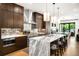 Contemporary kitchen with stainless steel appliances, marble island, and modern lighting at 340 Milwaukee St, Denver, CO 80206