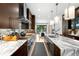 Spacious kitchen with long island, stainless appliances, and hardwood floors at 340 Milwaukee St, Denver, CO 80206