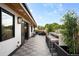 Expansive outdoor patio with bamboo fencing, tile floors, an outdoor kitchen, and dining area, ideal for gatherings at 340 Milwaukee St, Denver, CO 80206