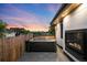 Outdoor patio featuring a hot tub and fireplace for relaxation, perfect for enjoying evenings outside at 340 Milwaukee St, Denver, CO 80206