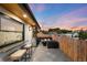 Outdoor patio with seating area, fireplace, bar, and grill, perfect for entertaining friends and Gathering at 340 Milwaukee St, Denver, CO 80206