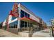 Exterior view of Alamo Drafthouse Cinema, showing the building and patio seating at 1371-1373 Wolff St, Denver, CO 80204