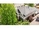 Aerial view showcasing the house with trees, gray roof, and a porch at 1317 S Saint Paul St, Denver, CO 80210