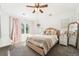 Bright bedroom with pink accents, large windows, and comfortable bedding at 1317 S Saint Paul St, Denver, CO 80210