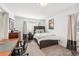 Well-lit bedroom with study desk area, plush carpet, and natural light from the window at 1317 S Saint Paul St, Denver, CO 80210