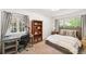 Cozy bedroom with ample natural light, a comfortable bed, and a dedicated workspace at 1317 S Saint Paul St, Denver, CO 80210
