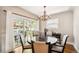 Dining room with a view of the patio and chandelier lighting at 1317 S Saint Paul St, Denver, CO 80210