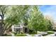 Charming two-story home with a well-manicured lawn and mature trees at 1317 S Saint Paul St, Denver, CO 80210