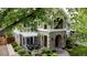 Stately home with arched entrance and a pergola covered patio at 1317 S Saint Paul St, Denver, CO 80210