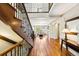 Stunning foyer featuring hardwood floors, an elegant staircase, and abundant natural light at 1317 S Saint Paul St, Denver, CO 80210