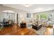 Bright living room with hardwood floors and a view into the dining room at 1317 S Saint Paul St, Denver, CO 80210