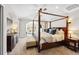 Spacious main bedroom suite with four-poster bed, sitting area, and beautiful arched doorways at 1317 S Saint Paul St, Denver, CO 80210