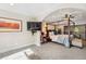 Primary bedroom with canopy bed, ceiling fan, and TV, creating a cozy and inviting retreat at 1317 S Saint Paul St, Denver, CO 80210