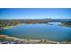 Expansive aerial view of a lake with the cityscape skyline visible in the distance on a clear day at 3943 W 12Th Ave, Denver, CO 80204