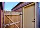The backyard area features a wooden fence and door at 3943 W 12Th Ave, Denver, CO 80204