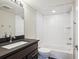 Modern bathroom featuring sleek vanity, tiled walls, and a clean, stylish design at 3943 W 12Th Ave, Denver, CO 80204