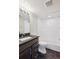 Modern bathroom featuring sleek vanity, tiled walls, and a clean, stylish design at 3943 W 12Th Ave, Denver, CO 80204