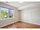 Bright bedroom with large window and hardwood floors at 3943 W 12Th Ave, Denver, CO 80204