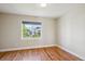 Bright bedroom with hardwood floors and natural light, offering a serene and inviting atmosphere at 3943 W 12Th Ave, Denver, CO 80204