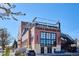 Exterior shot of Odell Brewing Co. featuring a rooftop area, brick facade and industrial design elements at 3943 W 12Th Ave, Denver, CO 80204