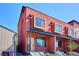 Modern townhome with a rust colored exterior and box style windows at 3943 W 12Th Ave, Denver, CO 80204