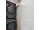 Modern laundry room with stacked Samsung washer and dryer, adding convenience and efficiency at 3943 W 12Th Ave, Denver, CO 80204