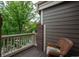 Private balcony with a wicker chair, offering a relaxing outdoor space at 9165 Kornbrust Dr, Lone Tree, CO 80124