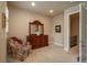 Comfortable bedroom featuring a cozy chair, large dresser, and ample natural light at 9165 Kornbrust Dr, Lone Tree, CO 80124