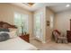 Bright bedroom with a skylight, plantation shutters, and comfortable furnishings at 9165 Kornbrust Dr, Lone Tree, CO 80124