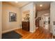 Inviting foyer with hardwood floors, decorative accents, and view to the staircase and dining area at 9165 Kornbrust Dr, Lone Tree, CO 80124