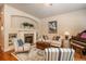 Inviting living room featuring a fireplace, built-in shelving, and stylish furnishings at 9165 Kornbrust Dr, Lone Tree, CO 80124