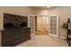 Inviting living room featuring a large TV and access to the home's upstairs area at 9165 Kornbrust Dr, Lone Tree, CO 80124