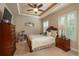 Serene main bedroom with a ceiling fan, plantation shutters, and comfortable furnishings at 9165 Kornbrust Dr, Lone Tree, CO 80124